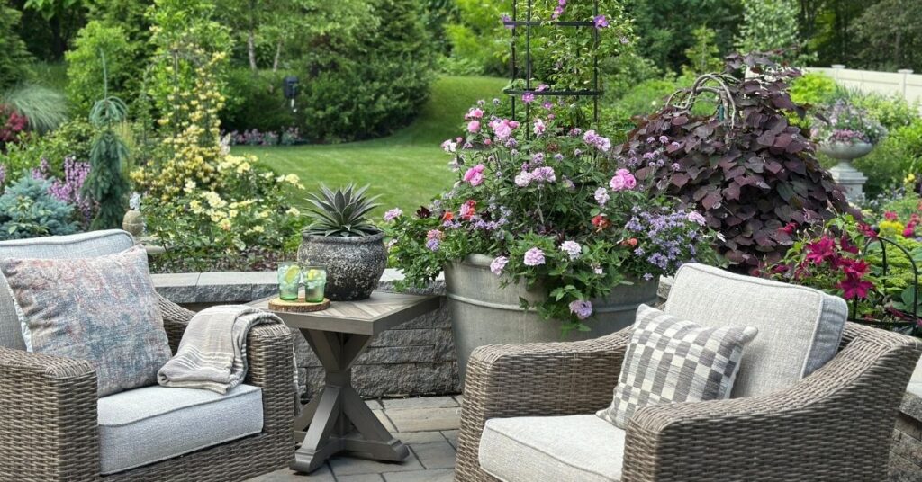patio with chairs and flowers